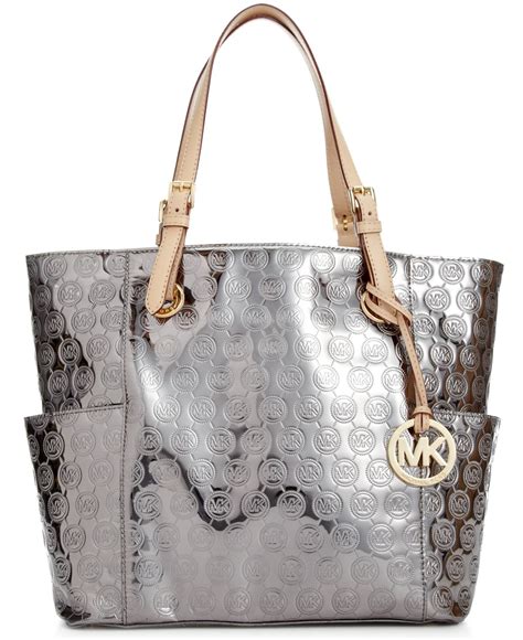 michael kors leather silver with side pocket|Michael Kors leather tote.